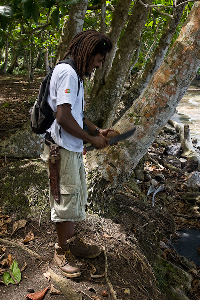 Omar prepares the coconut.