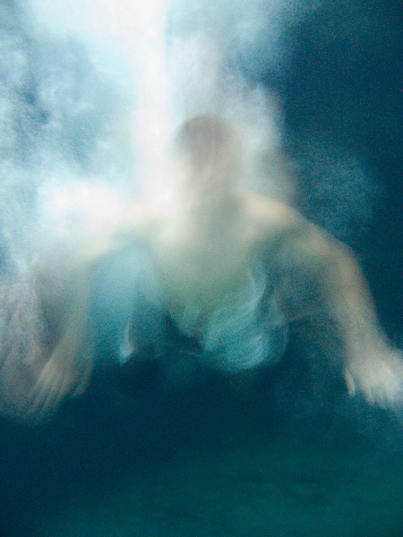 This is what someone diving in to the pool looks like from underwater with a slow shutter speed. In this case this is Mark.